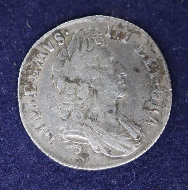 A William III silver shilling, 1697, third head, F